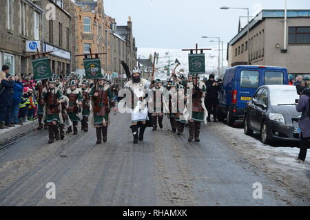 The 2019 Up Helly Aa fire festival held in Lerwick Shetland in January every year led by the Guizer Jarl his viking galley and his squad Stock Photo