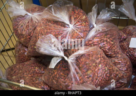 Grains of peanuts in plastic packaging. Packets of peanuts Stock Photo