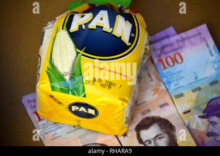 harina pan corn flour next to pan with arepa in it Stock Photo - Alamy