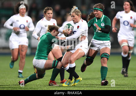 England's Natasha Hunt is tackled by Ireland's Claire Molloy (left) and Claire McLaughlin during the Women's Six Nations match at Energia Park Donnybrook, Dublin. Stock Photo