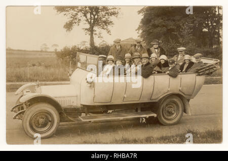 Early 1900's postcard of charabanc outing in countryside, circa 1925, women wear fashionable cloche hats, U.K. Stock Photo