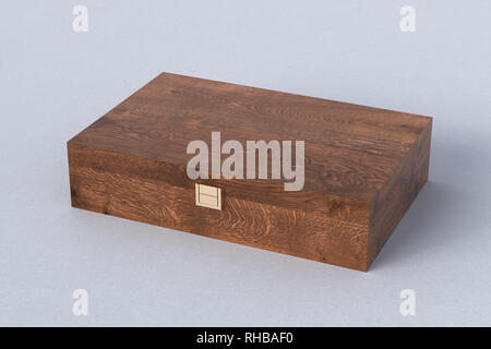 Dark wooden closed long box or casket on white background Stock Photo