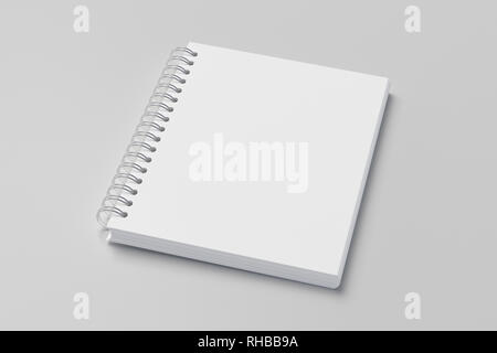 Blank vertical spiral notepad on white background. With clipping path around notebook pages Stock Photo