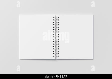 Blank open vertical spiral notepad on white background. With clipping path around notebook pages Stock Photo