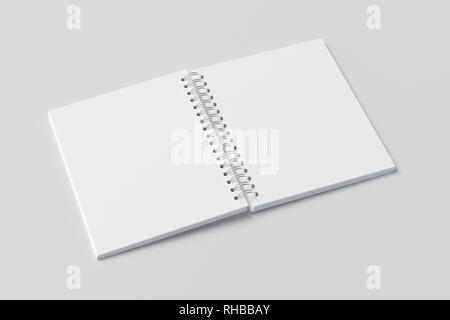 Blank open vertical spiral notepad on white background. With clipping path around notebook pages Stock Photo