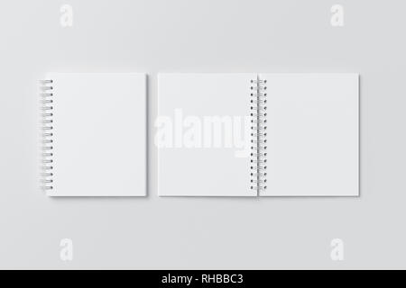 Blank open and closed vertical spiral notepads on white background. With clipping path around notebooks pages Stock Photo