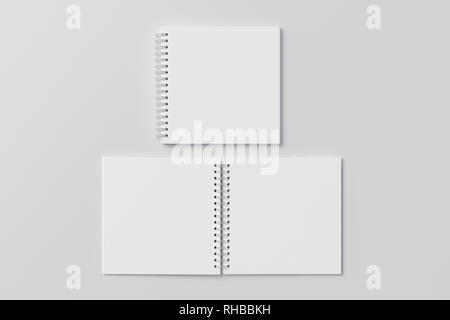Blank open and closed square spiral notepad on white background. With clipping path around notebooks pages Stock Photo
