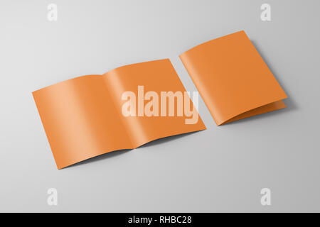 Blank brown open and folded half-folded flyer leaflet on white background. With clipping path around brochure Stock Photo