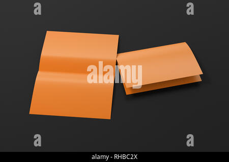 Blank brown open and folded half-folded flyer leaflet on black background. With clipping path around brochure Stock Photo