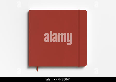 Red square notebook with elastic band on white background Stock Photo