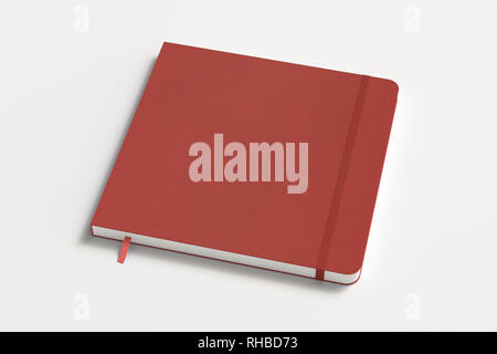 Red square notebook with elastic band on white background Stock Photo
