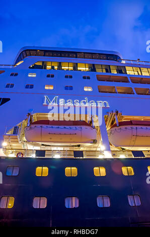 Cruise ship ms Maasdam name glows in bright lights after sunset, Holland America Cruise Line Stock Photo