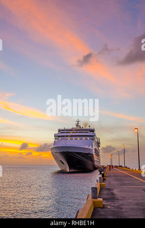 Cruise ship docked Frederiksted pier at twilight colortful clouds ms Maasdam Saint Croix, United  States Virgin Islands  USVI Stock Photo