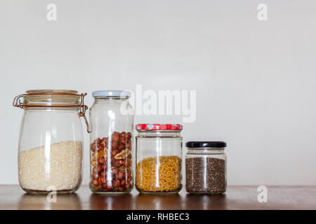 Food in glass jars on wooden table with copy space. Zero Waste, plastic free concept Stock Photo