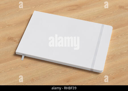 White horizontal notebook with elastic band on wooden background Stock Photo