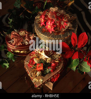 DECORATED GOLD CHRISTMAS GIFT BOXES AND BASKETS. Stock Photo