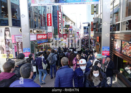 Takeshita Street is a pedestrian shopping street lined with fashion boutiques, cafes and restaurants in Harajuku in Tokyo, Japan. Stock Photo