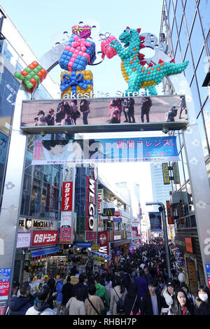 Takeshita Street is a pedestrian shopping street lined with fashion boutiques, cafes and restaurants in Harajuku in Tokyo, Japan. Stock Photo