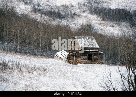 An old abandoned homestead/farmhouse in winter. Stock Photo