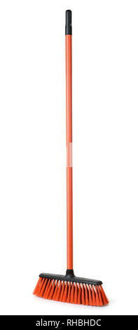 Red plastic broom isolated on white Stock Photo