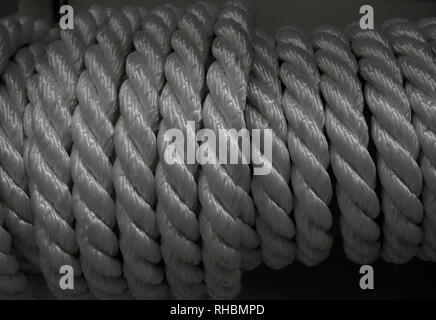 Bobbin of rough nylon twisted cord closeup texture background Stock Photo