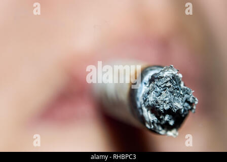 woman smoking, restrictive focus image, face Stock Photo