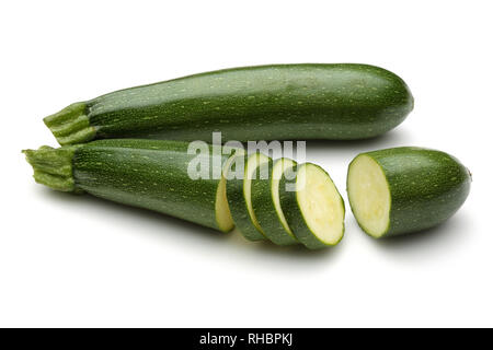 Green zucchini with slices isolated on white background Stock Photo