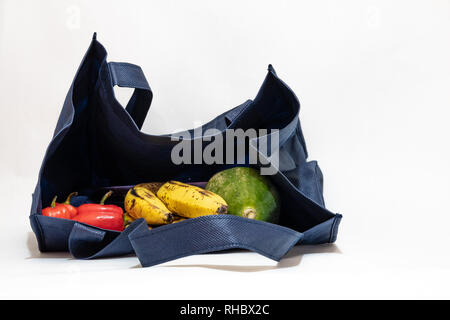 Reusable shopping/ grocery bag with fruits isolated on white background Stock Photo