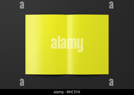 Blank yellow half-folded flyer leaflet on black background. With clipping path around brochure Stock Photo