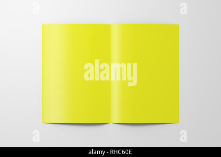 Blank yellow half-folded flyer leaflet on white background. With clipping path around brochure Stock Photo