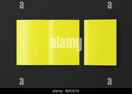 Blank yellow half-folded flyer leaflet on black background. With clipping path around brochure Stock Photo