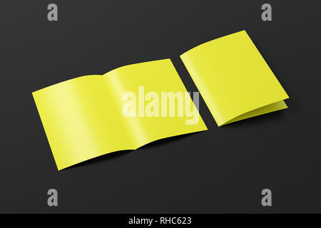 Blank yellow half-folded flyer leaflet on black background. With clipping path around brochure Stock Photo