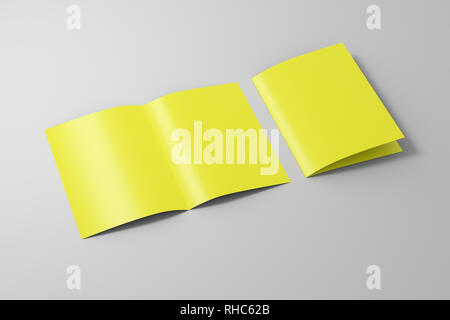 Blank yellow half-folded flyer leaflet on white background. With clipping path around brochure Stock Photo