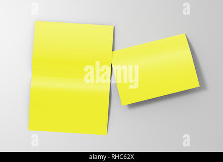 Blank yellow open and folded half-folded flyer leaflet on white background. With clipping path around brochure Stock Photo