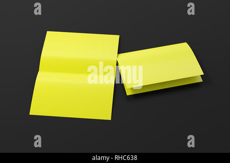 Blank yellow open and folded half-folded flyer leaflet on black background. With clipping path around brochure Stock Photo