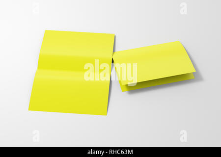 Blank yellow open and folded half-folded flyer leaflet on white background. With clipping path around brochure Stock Photo