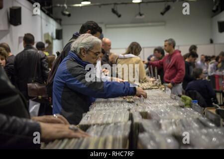 A man seen searching for vinyl during the event. Vinyl Market is a festival with many new disc collections, many collectibles and new releases. It also has collections of other music themes, CDs, Posters, music magazines, books and many other related exhibits. Stock Photo