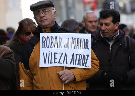 Madrid, Spain. 2nd Feb, 2019. Pensioner with a banner claiming decent pensions Credit: Jesus Hellin/ZUMA Wire/Alamy Live News Stock Photo