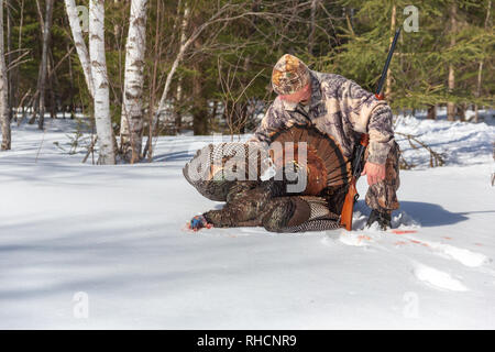 Hunter posing with his spring turkey in northern Wisconsin. Stock Photo