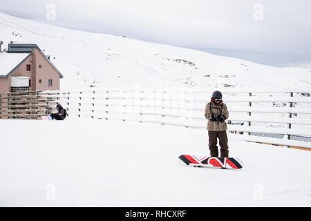People get ready to snowboard at the Sierra Nevada ski resort. Stock Photo