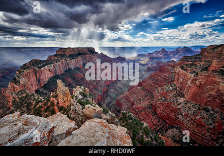 thunderstorm and sun beams over Grand Canyon, Wotans Throne, Cape Royal viewpoint, Arizona, USA Stock Photo