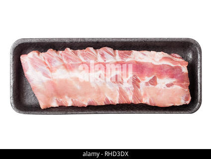 Plastic tray of raw pork ribs for barbeque on white. Stock Photo