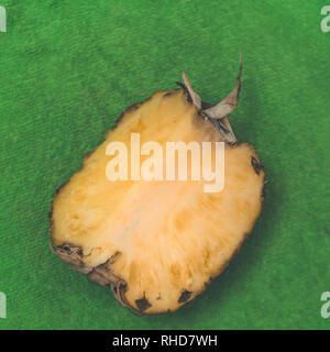 Pineapple on green background Stock Photo