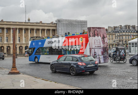 Paris, France - Oct 3, 2018. Sightseeing bus at La Concorde Square in Paris city, France. Paris is a global center for art, fashion, gastronomy and cu Stock Photo