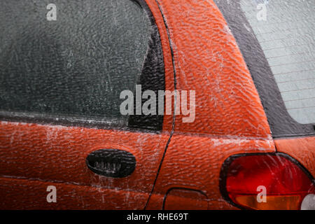 Car covered in ice after a freezing rain phenomenon Stock Photo