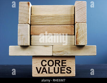 Tower of wooden blocks with sign core values. Stock Photo