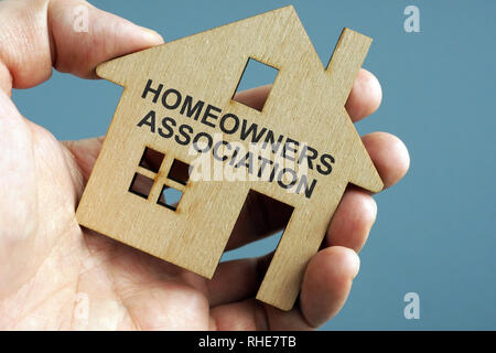 Homeowners Association HOA written on a model of home. Stock Photo