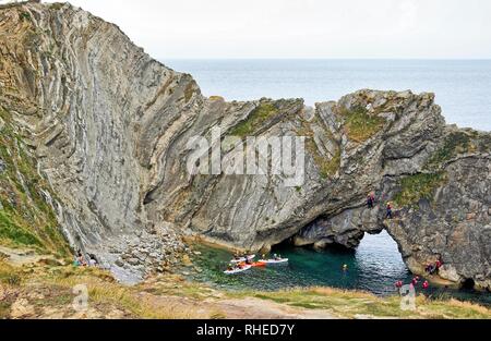 Rock climbing, tombstoning, canoeing and orienteering at Lulworth Cove, Dorset, UK. Part of the Jurassic coast. Stock Photo