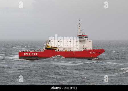 The pilot ship Elbe Pilot waits in front of the port of Cuxhaven on 1 January 2019 for ships. Stock Photo