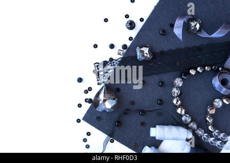A set of materials for needlework in grey color on a white background. Stock Photo